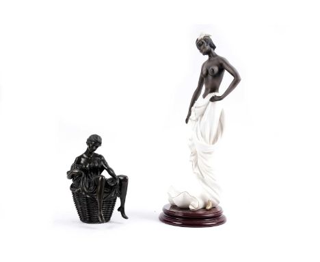 A patinated bronze figural box, formed as a lady in a draped robe, perched over a basket, signed 'Nick' to underside, 21cms h