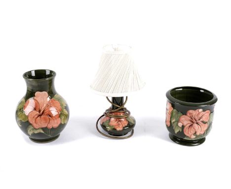 A Moorcroft 'Hibiscus' pattern table lamp, tubeline decorated with flowers on a green ground, impressed marks to underside, 3