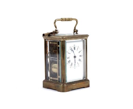 A 19th Century brass carriage clock, the white enamel Roman dial with Arabic seconds markers, platform lever escapement, the 