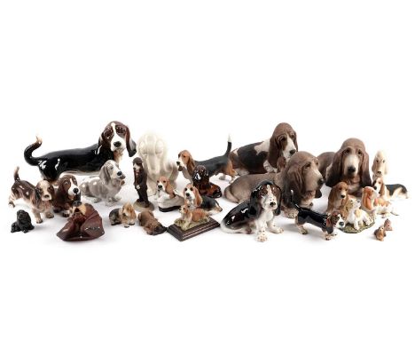 A collection of decorative ceramic and other figures of basset hounds, makers including: Goebel; Stef; Sandicast; Bosson; and