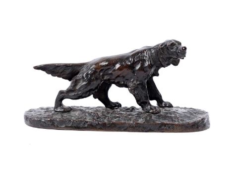 A late 19th Century bronze study of a red setter, stood on naturalistic base, 23cms long.