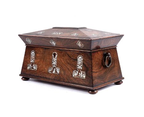 An early 20th Century rosewood tea caddy, with inlaid mother of pearl, fitted with two brass ring pull handles, the lid openi