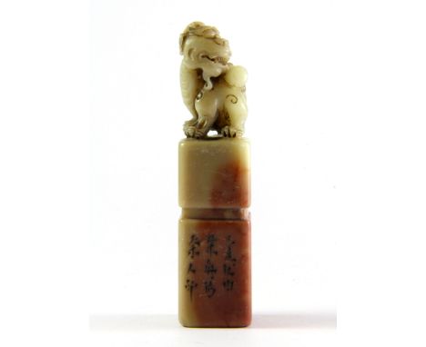 A mixed colour mid 20th Century Chinese carved soapstone seal, H. 9cm.