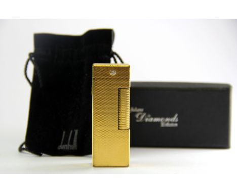 A Dunhill gold plated diamond set lighter, H. 6.3cm.