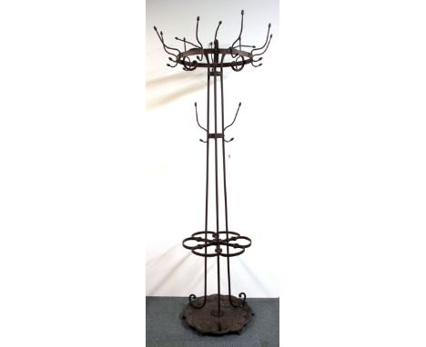 A superb 19th Century iron coat and hat stand, H. 202cm.
