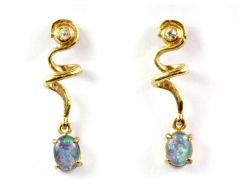 A pair of yellow metal opal doublet and white stone set drop earrings.
