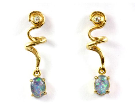 A pair of yellow metal opal doublet and white stone set drop earrings.