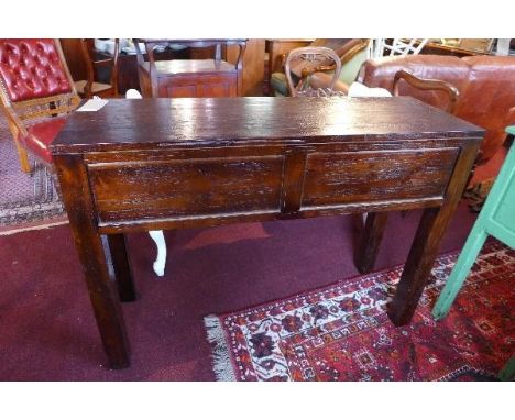 A contemporary stained teak console table, having two drawers, raised on square legs, H.86 W.120 D.40cm 