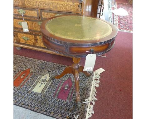 A 20th century mahogany lamp table, in the form of a drum table 