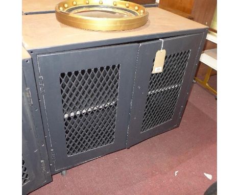 Four vintage metal coin lockers, raised on castors, reportedly from the Bank of England 