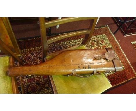 A vintage moulded leather 'leg of mutton' gun case, monogrammed 'W.H.S.' 