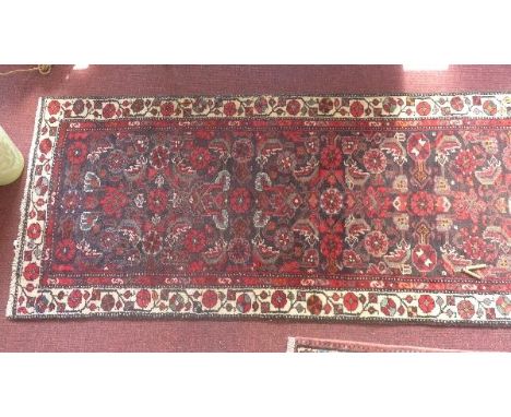 A fine North West Persian Farahan runner, repeating foliate and diamond motifs all over on a midnight field within stylised i
