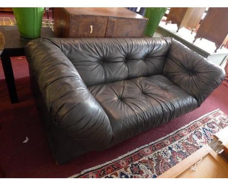 A 20th century black leather sofa, with button down upholstery 