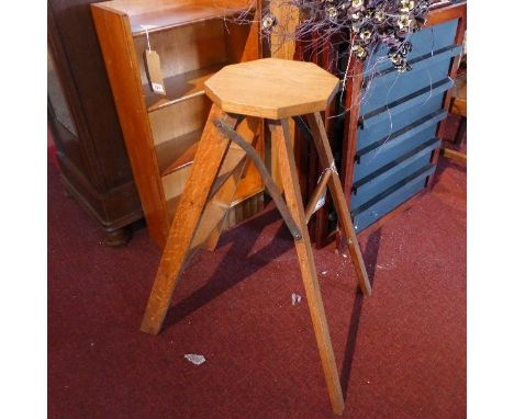 An early 20th century oak folding step ladder 