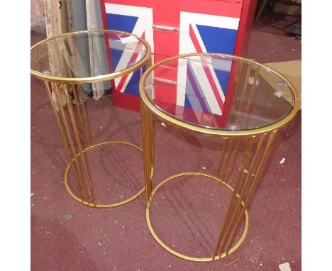 A pair of gilt metal lamp tables, with glass tops 