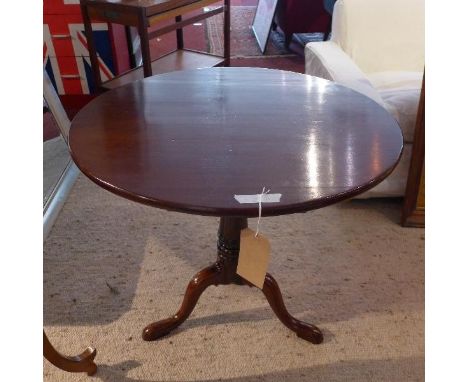 A late 19th century mahogany tilt top table, raised on tripod base 