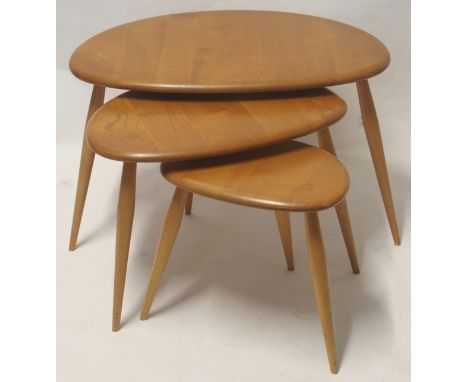 A LIGHT ERCOL NEST OF THREE TABLES 40cm high x 66cm wide x 44cm deep Condition Report: Some water marks on largest table, vis