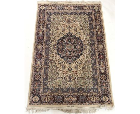 A LIGHT GROUND EASTERN RUG with blue central medallion with signature, 220cm x 139cm Condition Report: Available upon request