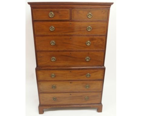 A MAHOGANY AND SATINWOOD CROSS BANDED CHEST ON CHEST with two over three graduating drawers on three base drawers with bracke