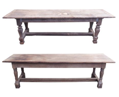 TWO OAK REFECTORY TABLES each with three plank top, with square baluster legs, joined by a stretcher, the other table on balu