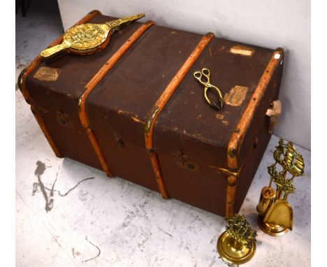 An early 20th century canvas steamer trunk, oak and brass bound with inner tray, bearing some partial shipping labels, approx