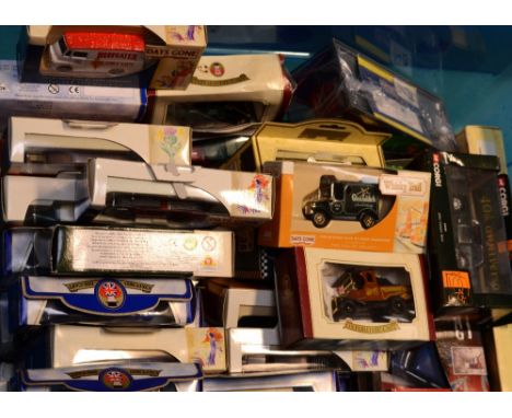 A collection of approximately fifty boxed scale model vehicles including Corgi, Lledo etc.