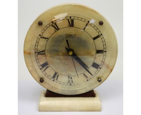 An Art Deco style marble Temco circular mantel clock on rectangular marble base, the face set with Roman numerals, height 20c