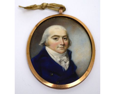 UNATTRIBUTED; 19th century portrait miniature of a gentleman in blue jacket, in a yellow metal frame.   CONDITION REPORT  Dim