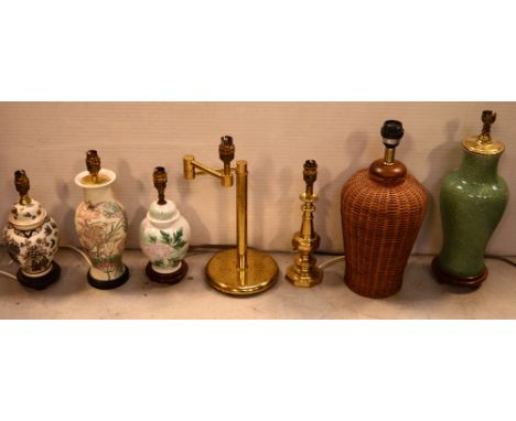 Seven table lamps to include wicker baluster vase shaped lamp base, a celadon green crackle glaze lamp base, two brass lamp b