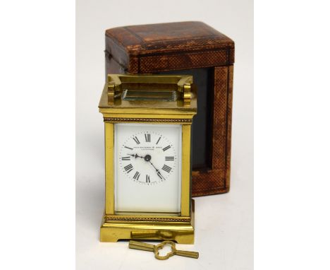 A late 19th century brass carriage clock, enamel dial set with Roman numerals and inscribed 'John Bagshaw & Sons, Liverpool',
