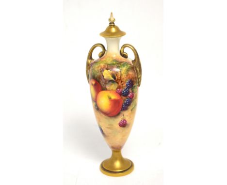 A Royal Worcester vase, shape 2710, painted with fruit by Frank Higgins, shape no.2710, gilt foot, handles and cover with spi