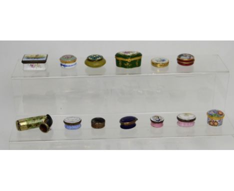 Six late 18th/early 19th century Bilston enamel pill boxes, several modern examples and a pipe.