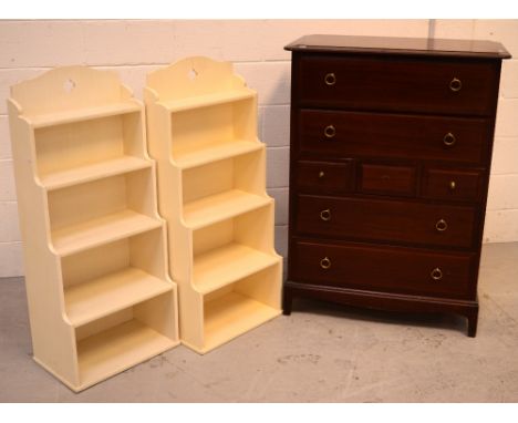 A pair of contemporary cream-painted 'Waterfall' five-shelf bookcases, 114 x 46cm and a Stag four-drawer chest of drawers on 