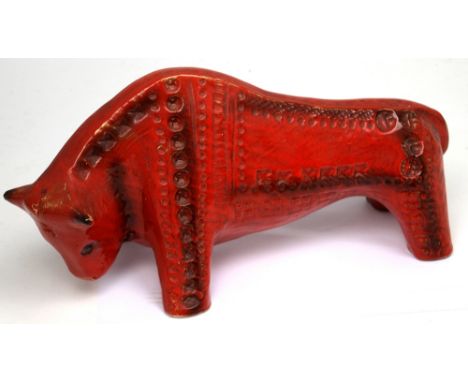A Bitossi-style ceramic model of a bull with incised decoration in red glaze, length 36cm.   CONDITION REPORT  No obvious sig