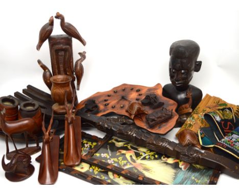 A quantity of turned and carved wood to include an African carved hardwood bust of a man, two wall plaques of carved gazelle,