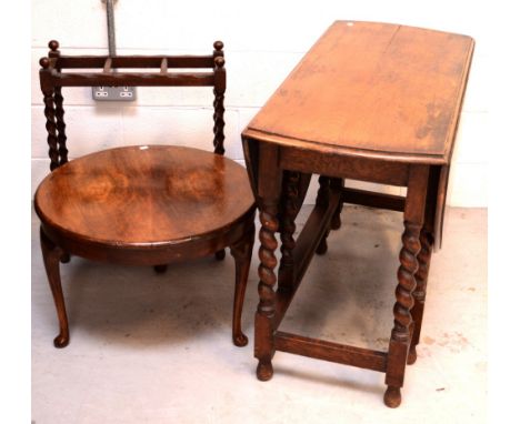 A late Victorian oak gate-leg table raised on twist supports, an oak stick stand and a circular mahogany coffee table raised 