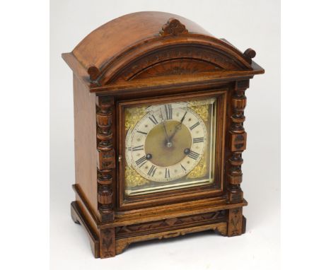 A late 19th century walnut-cased eight-day mantel clock, height 32.5cm.