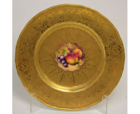 A Royal Worcester cabinet plate painted by Christopher Hughes with peaches and grapes to centre, gilt border, diameter 28cm. 