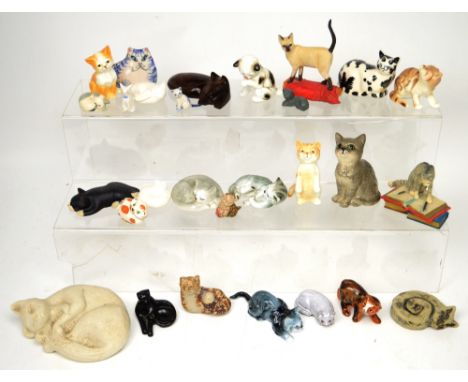 A Royal Doulton, DA128 Persian kitten, together with a small collection of other ceramic, stone and carved wood cats.