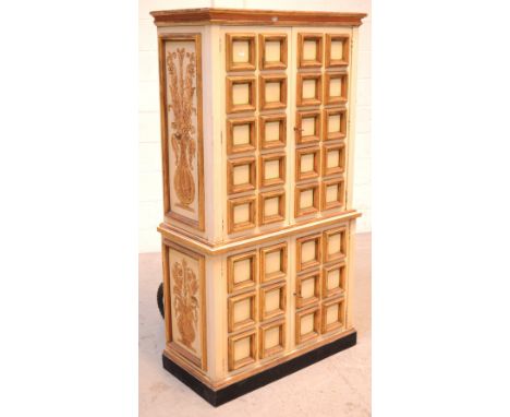 A contemporary four-door cupboard in the Italian style, two panel doors open to reveal five drawers, above cupboard containin