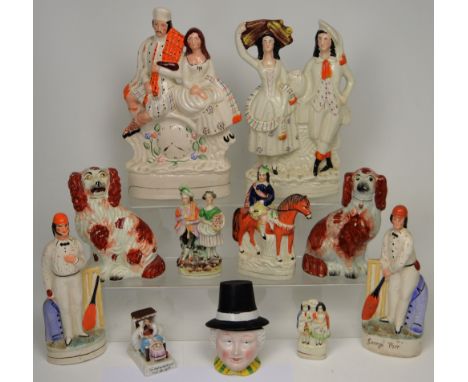 Seven Staffordshire flatback figures to include George Parr (af), three sets of courting couples, two spaniel dogs, a Fieldin