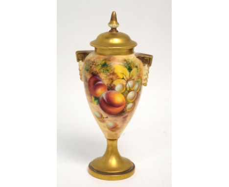 A small Royal Worcester vase and cover, shape 2173, painted with peaches and grapes by Frank Roberts, shape no.2713, gilt fin