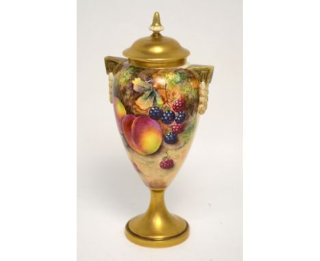 A Royal Worcester vase and cover, shape 2713, painted with fruit by Frank Higgins, gilt handles with gilt foot, two-tone gilt