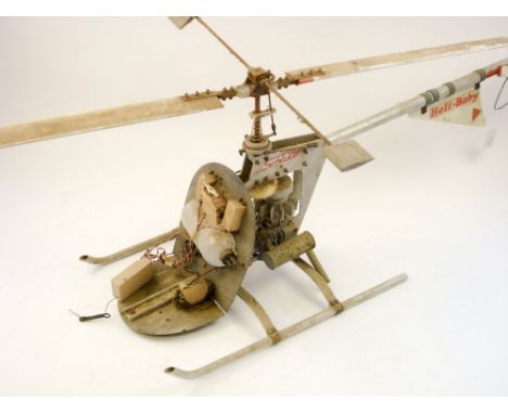 A radio control scale model of a Motor Torpedo Boat and a Schluter 'Heli-Baby' helicopter with 'glow-plug' engine:, (both a/f