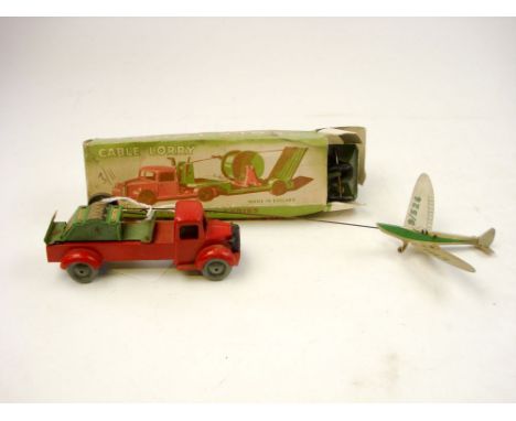 A Wells Brimtoy Pocketoy lorry and glider:, red metal cab and chassis, black radiator  and grey wheels, aluminium glider numb