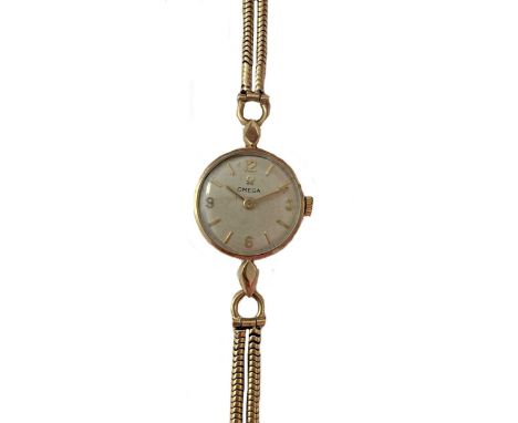 circa 1962, the signed circular silvered dial, 17mm diameter, with gold coloured quatre Arabic numerals and hands, signed 17 