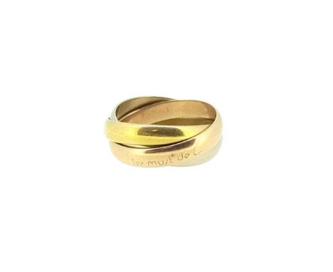 rose, white and yellow metal plain polished bands, the rose coloured band has a worn inscription that reads 'Les must de Cart