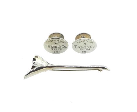 first, a pair of oval shaped cufflinks, 2 x 1.5cm, engraved with 'PLEASE RETURN TO TIFFANY &amp; Co NEW YORK', bar connection