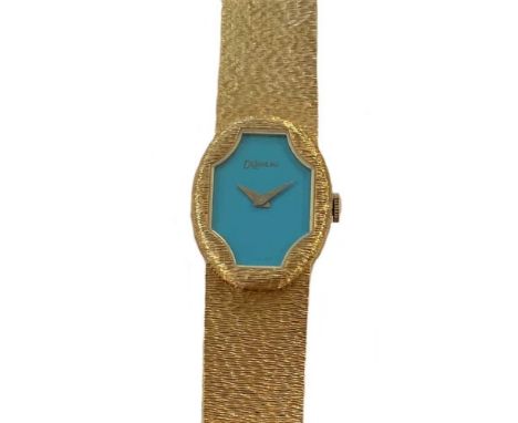 circa 1978, serial number 1293V, the signed tonneau shaped turquoise blue enamel dial within a fluted aperture, 16mm wide, wi