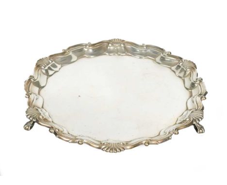 mark of Thomas Bradbury &amp; Sons Ltd., London 1897, 'Chippendale' style with shell and scroll rim, raised on three ball and